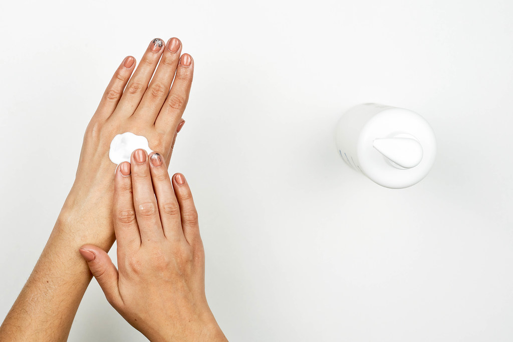 Woman hands massage rub cream 